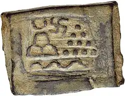 Taxila single-die local coinage. Pile of stones, hill, river and Swastika (220–185 BCE).