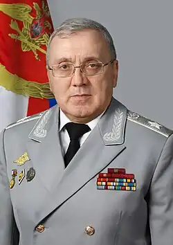 Ruslan Tsalikov in a grey dress uniform