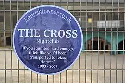 An imitation Blue Plaque commemorating The Cross, as it was being redeveloped.
