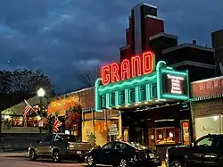 The neon lights of The Grand's marquee light up Main St. in downtown Ellsworth, Maine at dusk.