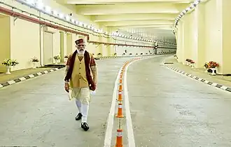 Prime Minister Narendra Modi is walking through the roads of the tunnel after its inauguration.