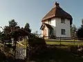 A pyramid roof with a chimney exiting the peak, The Round House, Finchingfield, Essex, England
