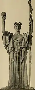 Statue of a woman holding a scepter and an orb