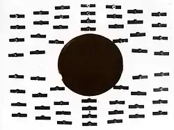 T = 4.2&nbsp;K, B = 8&nbsp;mT (80 G). Tin is in the normally conducting state. The compass needles indicate that magnetic flux permeates the cylinder.