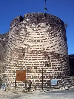 Tower to the left of the gateway