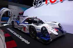 Blue-and-white race car on display