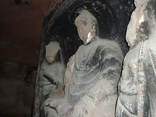 A damaged statue of the Buddha