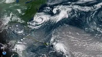 Satellite picture showing Chris (top left) near North Carolina and the remnants of Hurricane Beryl (bottom) near Hispaniola