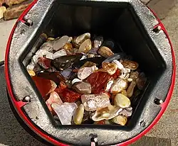 A 6.8&nbsp;kg (15&nbsp;lb) barrel full of tumble-polished agate and jasper