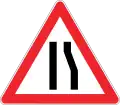 Road narrows on the right side