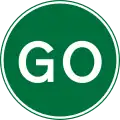 Go ahead or proceed for temporary road works using a hand sign
