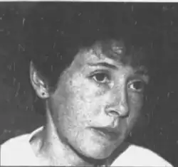 Black and white headshot of a woman with dark hair