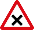 Intersection ahead in which priority must be given to vehicles on the right.