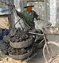 A man hauling material with a bicycle in Vietnam