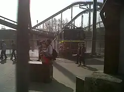 A partially submerged fire engine in the area surrounding the ride