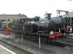 W24 Calbourne at Havenstreet station (Isle of Wight Steam Railway) in August 2010. Also visible are British Railways Class 03 No D2059 and WD92 Waggoner.