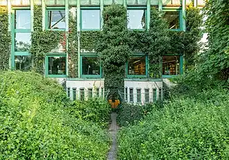 Vines cover the building exterior