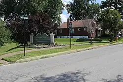 Welcome sign for Uplands Park, Missouri, July 2016