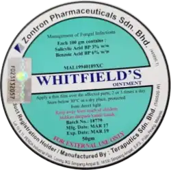 Circular design with green/turquoise and white backgrounds. The text 'Whitfield's ointment' in the centre and other text about ingredients and instructions placed in the green sections.
