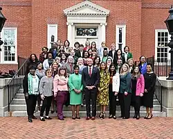 Members of the Women's Legislative Caucus of Maryland stand on the steps outside of the Governor's House