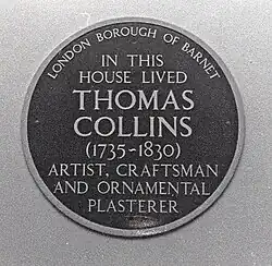 The plaque which hangs on the 1st floor of the new college