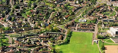 Aerial view of Woodside Road in Glenrothes showing homes, schools, landscaping and roads