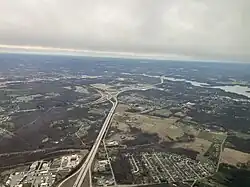 A collection of roads intersecting each other at an interchange, viewed from air.